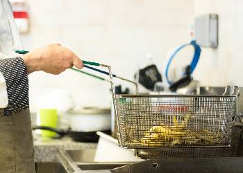 Restaurant kitchen deep fryer cooking french fries